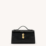 Black handbag with a gold clasp on a white background