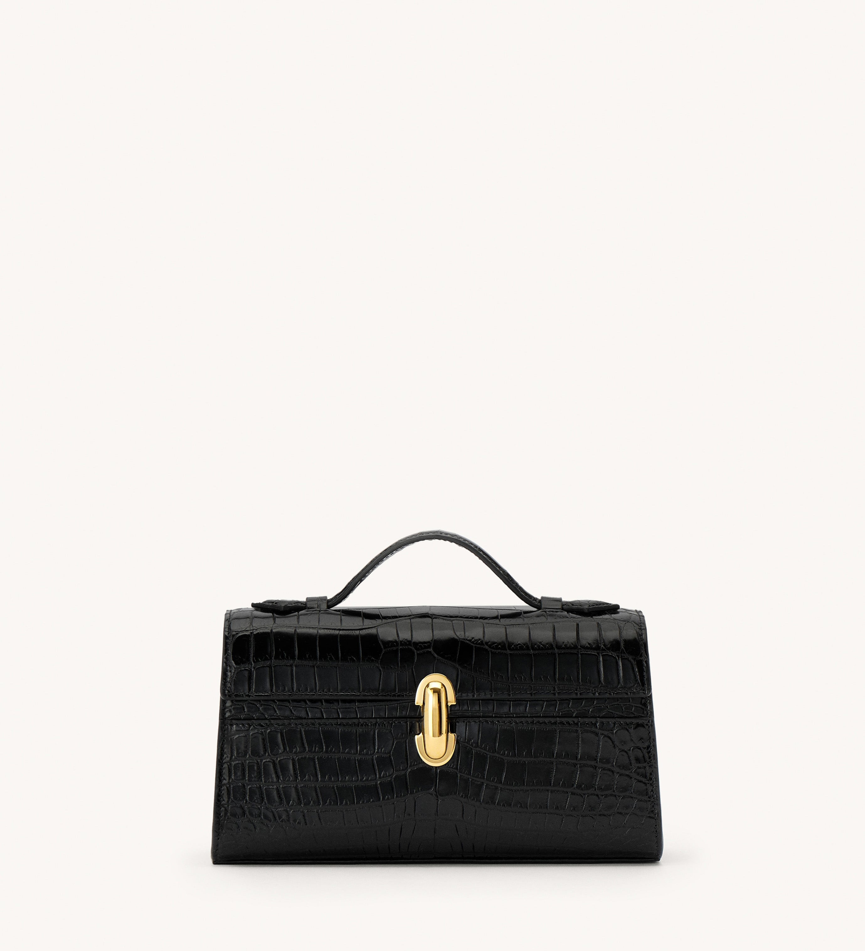 Black handbag with a gold clasp on a white background