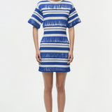 Woman wearing a blue and white striped knit mini dress with textured stripes and short sleeves.