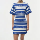Blue and white striped knit mini dress with fringe trim detail and short sleeves.