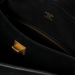 Image 4 of 4 - BLACK - Balenciaga Rodeo Handbag Medium is crafted from suede calfskin and smooth calfskin leather and features a structured yet relaxed silhouette with a top handle and removable shoulder strap. Designed with a turn-lock closure, aged-gold hardware, a removable cloche cls, a wide front pocket, and multiple interior compartments, the bag offers versatile carry options and everyday functionality. Main Material: Calfskin Leather. Lining: Nappa Lambskin. Made in Italy.