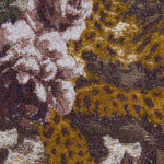 Close-up of the Marseille Mini Skirt, featuring Italian jacquard woven fabric with pink roses, white flowers, and green leaves set against a brown and gold background with intricate, textured detailing.