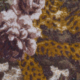 Close-up of the Marseille Mini Skirt, featuring Italian jacquard woven fabric with pink roses, white flowers, and green leaves set against a brown and gold background with intricate, textured detailing.