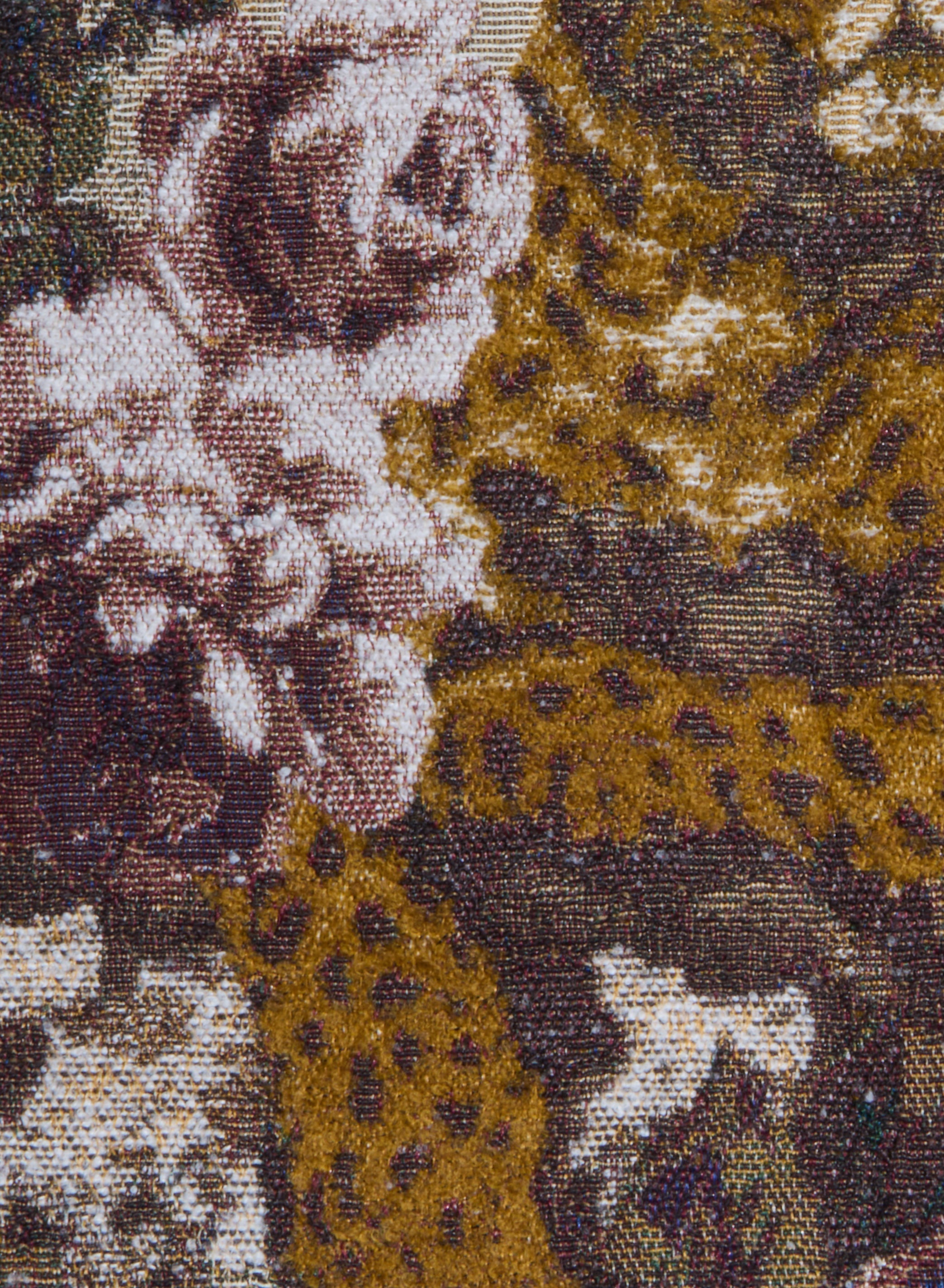 Close-up of the Marseille Mini Skirt, featuring Italian jacquard woven fabric with pink roses, white flowers, and green leaves set against a brown and gold background with intricate, textured detailing.