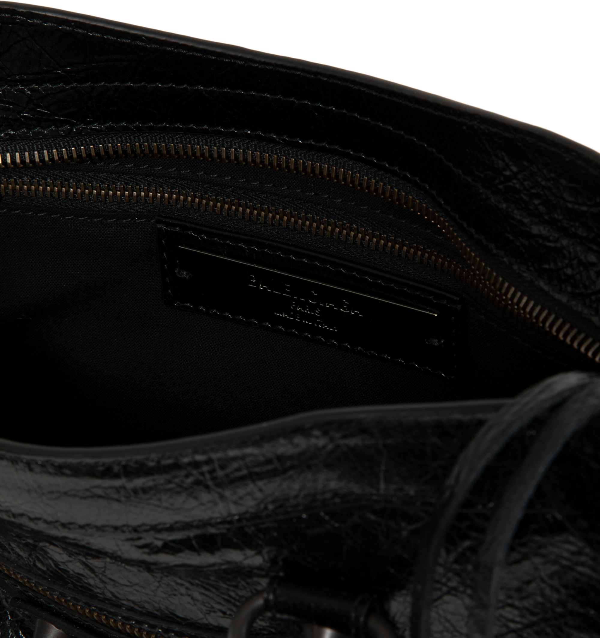 Image 3 of 3 - BLACK - Balenciaga Women's Le City Small Bag is crafted from supple leather and features the house's iconic slouchy silhouette with rolled top handles, signature buckle detailing, and an adjustable, detachable shoulder strap for versatile styling. Designed with a spacious zip-top main compartment, this designer handbag blends Balenciaga's archival motorcycle-inspired aesthetic with everyday functionality. Main Material: Leather. Dimensions: 30 x 19 x 10 cm. Made in Italy.