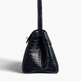 Khaite - Audrey Top Handle Bag in Midnight Alligator