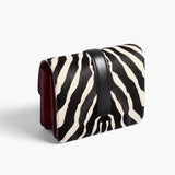 Khaite - Blake Crossbody Bag in Zebra Haircalf and Oxblood Leather