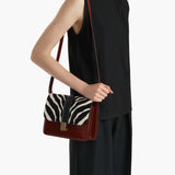 Khaite - Blake Crossbody Bag in Zebra Haircalf and Oxblood Leather