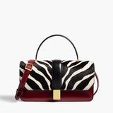 Khaite - Blake Top Handle Bag in Zebra Print Haircalf and Oxblood Leather