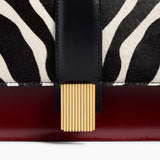Khaite - Blake Top Handle Bag in Zebra Print Haircalf and Oxblood Leather