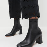 Elise Black Leather Stretch Ankle Bootie in black leather and Demi Embroidered Pant in Black.