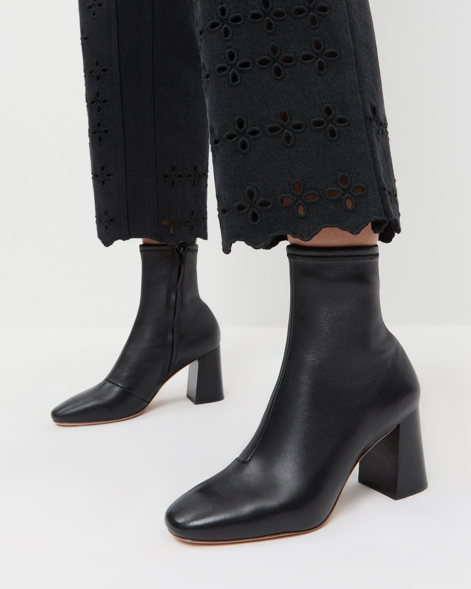 Elise Black Leather Stretch Ankle Bootie in black leather and Demi Embroidered Pant in Black.