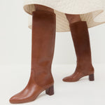 Gia Safari Leather Tall Boot in safari brown leather and Clara Quilted Skirt in cream.