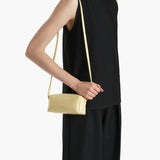 Khaite - Mini Kye Crossbody Bag in Pale Yellow Crackle Patent Leather