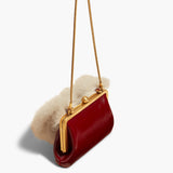 Khaite - Small Lilith Evening Bag in Oxblood Crackle Patent Leather with Shearling
