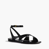 Khaite - Liria Ankle Strap Flat Sandal in Black Glazed Leather