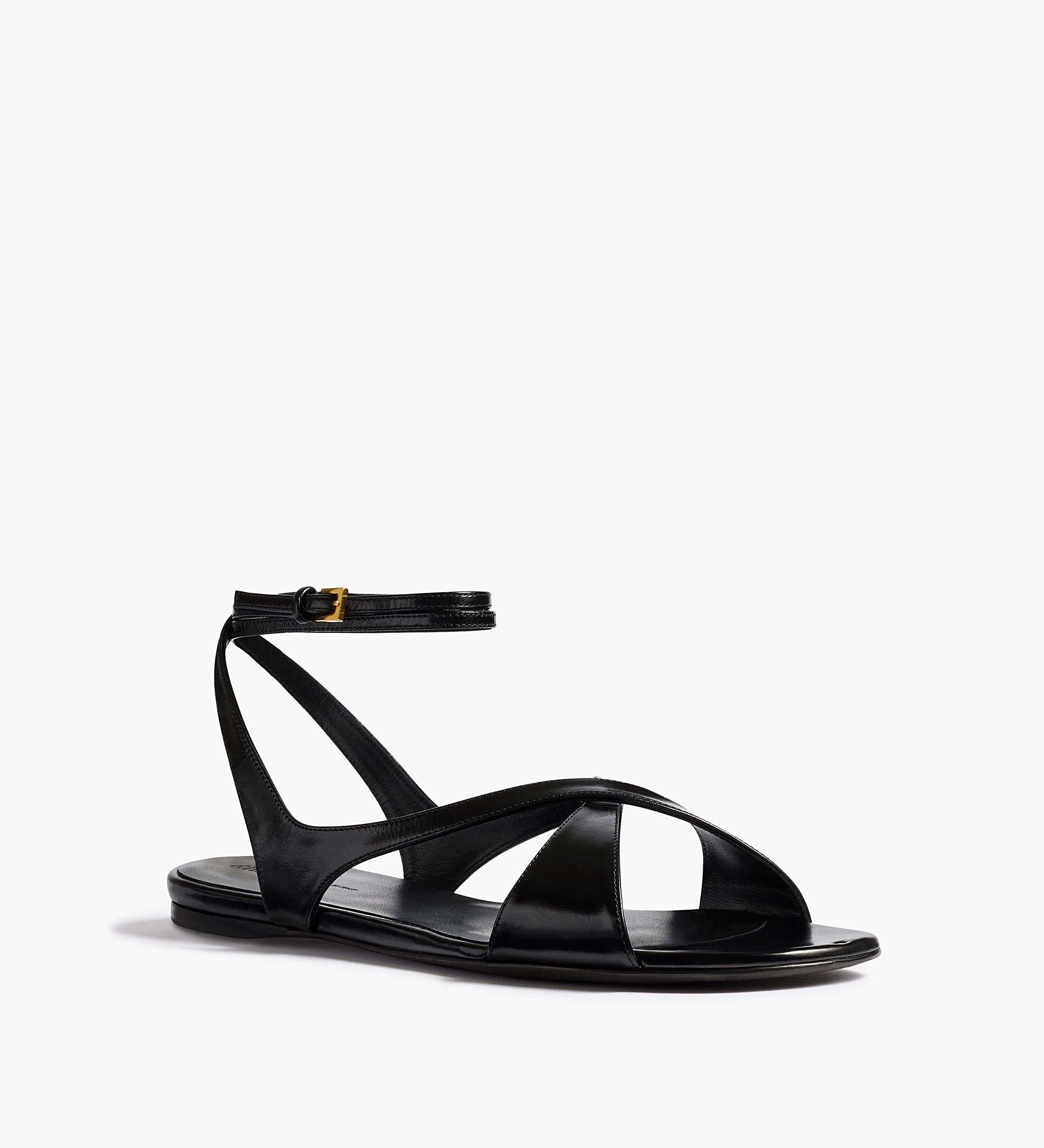 Khaite - Liria Ankle Strap Flat Sandal in Black Glazed Leather