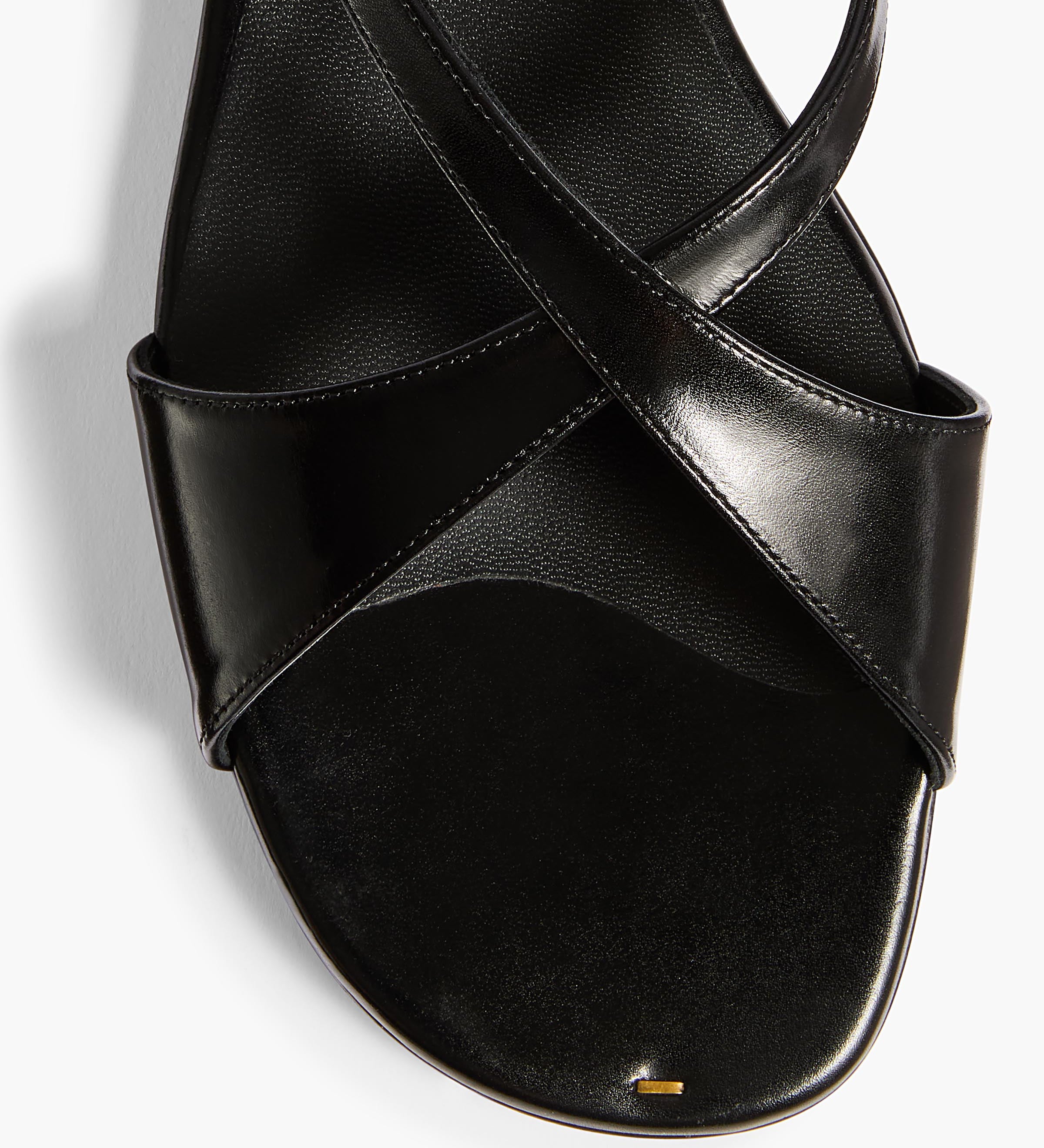 Khaite - Liria Ankle Strap Flat Sandal in Black Glazed Leather
