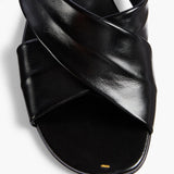 Khaite - Liria Flat Sandal in Black Glazed Leather