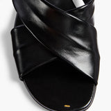 Khaite - Liria Flat Sandal in Black Glazed Leather