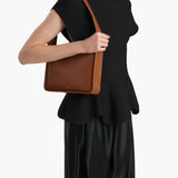 Khaite - Lori Squared Bag in Dark Honey Crackle Patent Leather