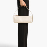 Khaite - Lori Baguette Bag in Cream Crackle Patent Leather