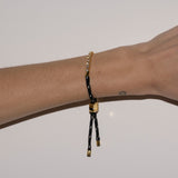 Dorsey - JAMES BEZEL NOIR ET BLANC PARACORD BRACELET, GOLD