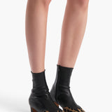 Khaite - Nevada Stretch Low Boot in Black Leather with Hyena Print Haircalf