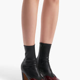 Khaite - Nevada Stretch High Boot in Black Leather with Oxblood Patent Leather