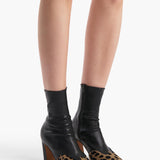 Khaite - Nevada Stretch High Boot in Black Leather with Hyena Print Haircalf
