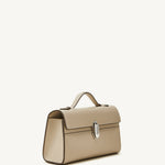 side view of the Symmetry Pochette handbag in Bone leather 