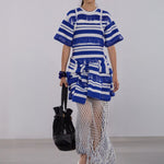 Blue and white striped knit mini dress with textured short sleeves and fringed hem detail.