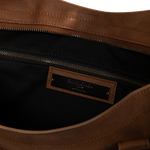 Image 3 of 3 - BROWN - Balenciaga Men's Le City Bag Large is crafted from vintage goatskin and features the house's iconic relaxed silhouette with two hand-braided handles detailed with waxed cord. Designed for hand or crossbody carry, this designer bag features an adjustable and removable shoulder strap with shoulder pad, brass hardware, a double-sided zip closure with long tails and knotted leather puller, front zipped pocket, interior zipped pocket, removable mirror with tone-on-tone Balenciaga logo, and