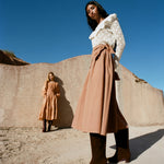 Cleo Brown Suede Mid-Calf Boot in brown suede, Abigail Top in cream crocheted cotton, and Peyton Skirt in light brown cotton.