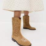 Jett Sand Suede Calf Boot in sand tan suede and western inspired and Clara Quilted Skirt in cream cotton.
