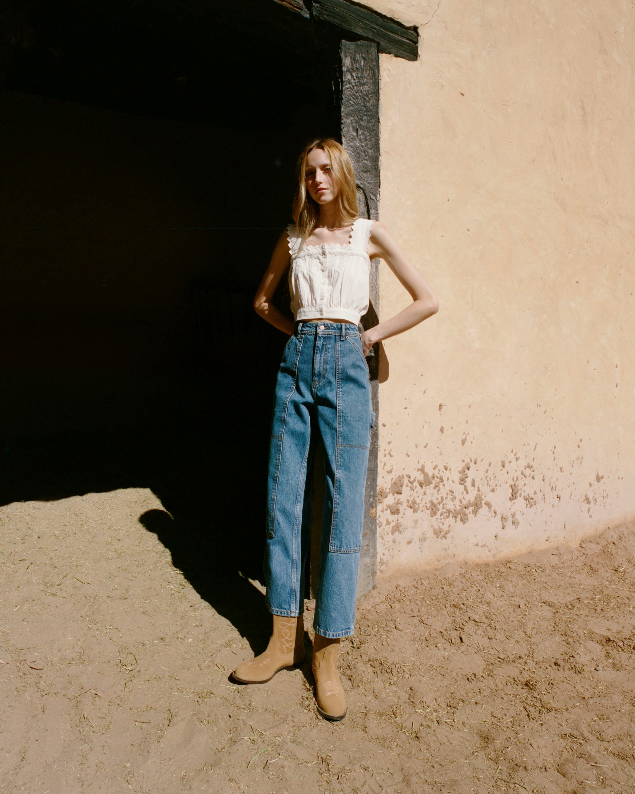 Jett Sand Suede Calf Boot in sand tan suede and western inspired, Runa Top in white cotton, and Molly Workwear Jean in medium washed denim.