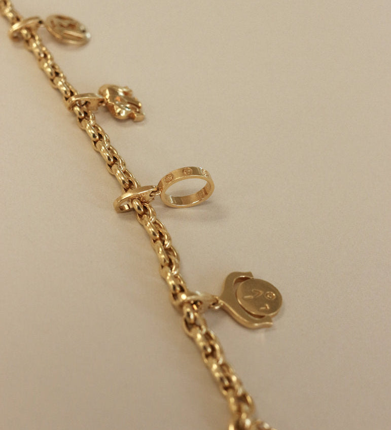 Kinn - Vintage 18k Gold Cartier Charm Bracelet