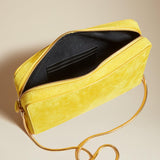 The Anna Crossbody Bag in Lemon Suede - The Iconic Issue