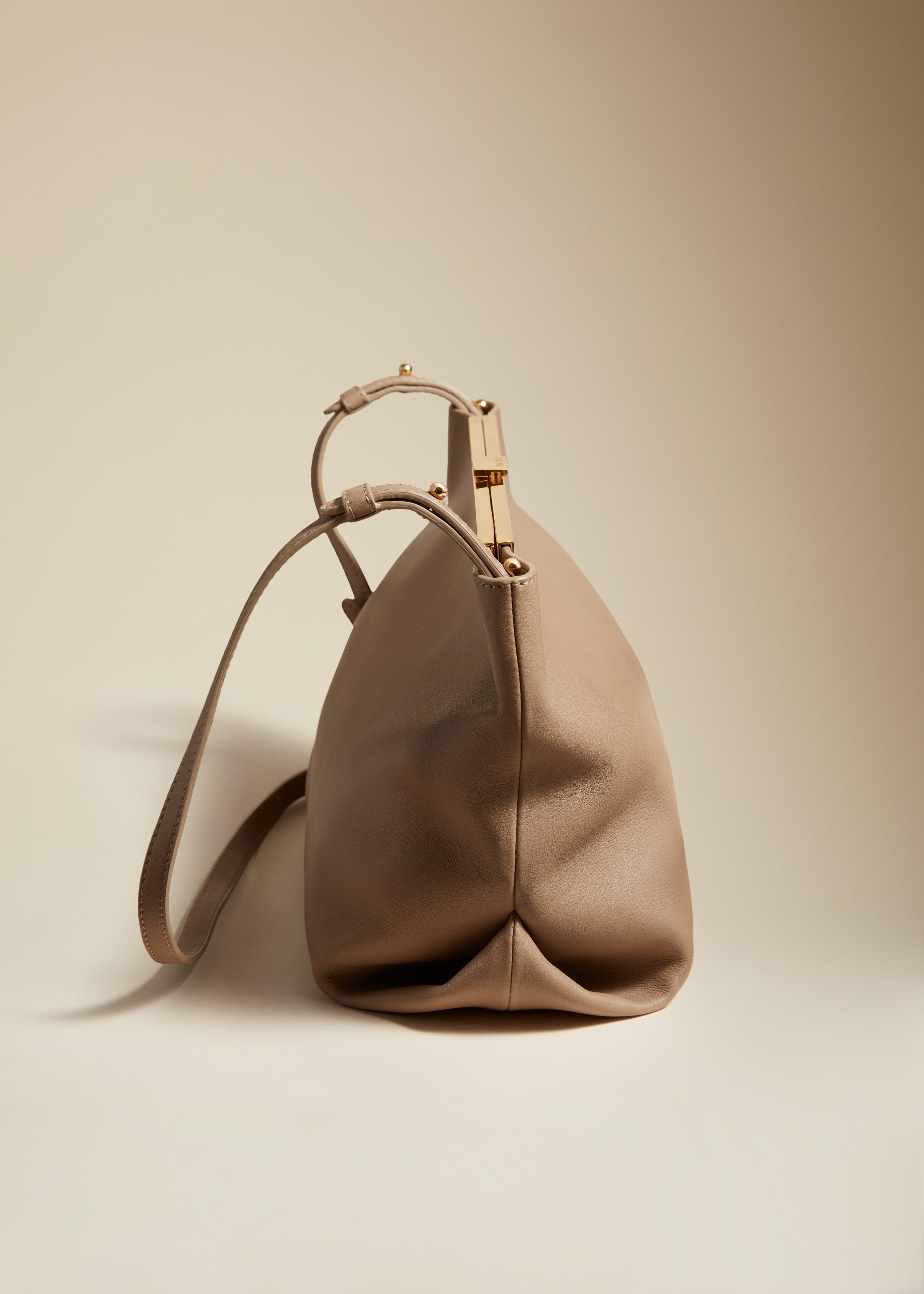 The Augusta Crossbody Bag in Taupe Pebbled Leather - The Iconic Issue