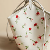 The Mini Lotus Drawstring Bag in White Leather with Floral Embroidery
