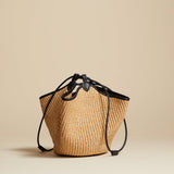 The Mini Lotus Drawstring Bag in Natural Raffia and Black Leather