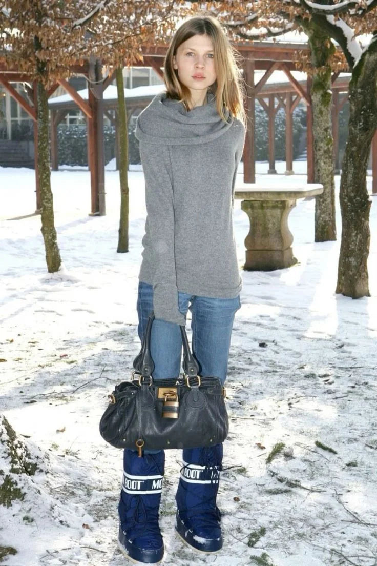 Black Paddington bag styled with a grey knit, jeans and snow boots.